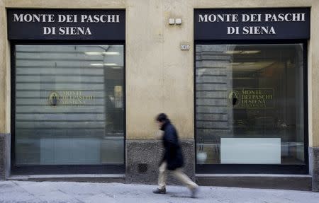 A man walks in front of the Monte dei Paschi bank in Siena, central Italy, January 29, 2016. REUTERS/Max Rossi