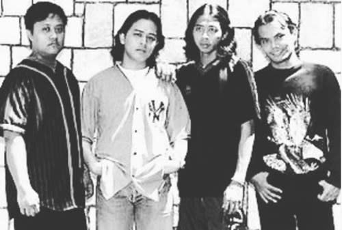 Tony (left) with Spider bandmates Tam, Yem and Nafie in 1998 .