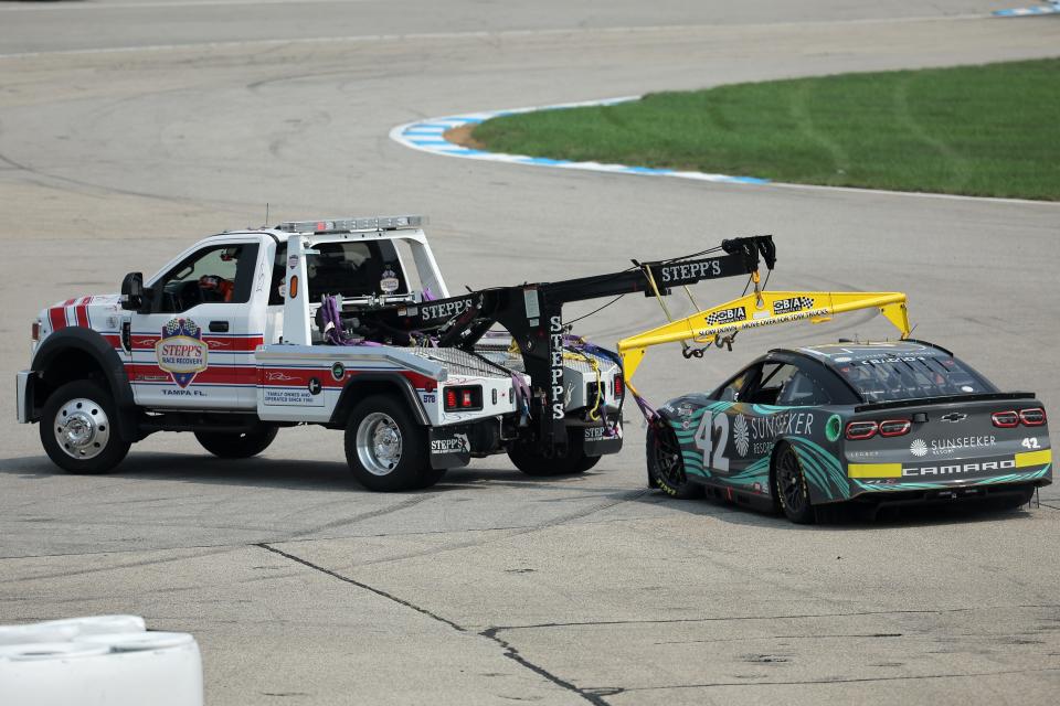 A sight that has become all-too familiar: Noah Gragson's No. 42 car being towed by a wrecker.