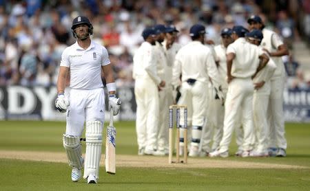 England's Matt Prior (L) leaves the field after being dismissed during the first cricket test match against India at Trent Bridge cricket ground in Nottingham, England July 11, 2014. REUTERS/Philip Brown