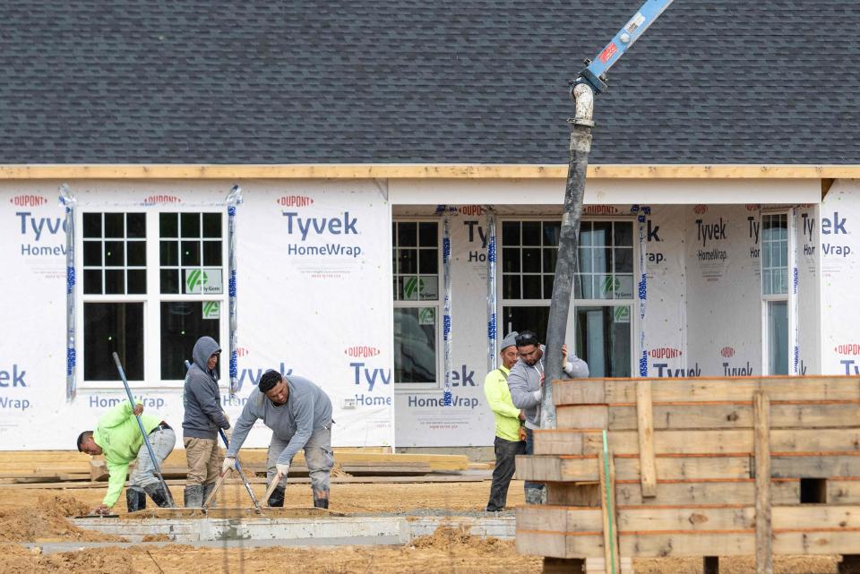 Workers lay the groundwork at a new home construction site in Trappe, Maryland, on October 28, 2022. - New home sales in the United States fell in September, official data showed on May 26. 10 in 2022, due to worsening affordability making ownership increasingly out of reach for many.  Sales spiked during the coronavirus pandemic as Americans bought homes thanks to bargain mortgage rates, but the sector cooled off with the US Federal Reserve raising lending rates as the agency efforts to reduce rising inflation.  (Photo by Jim WATSON/AFP) (Photo by JIM WATSON/AFP via Getty Images)