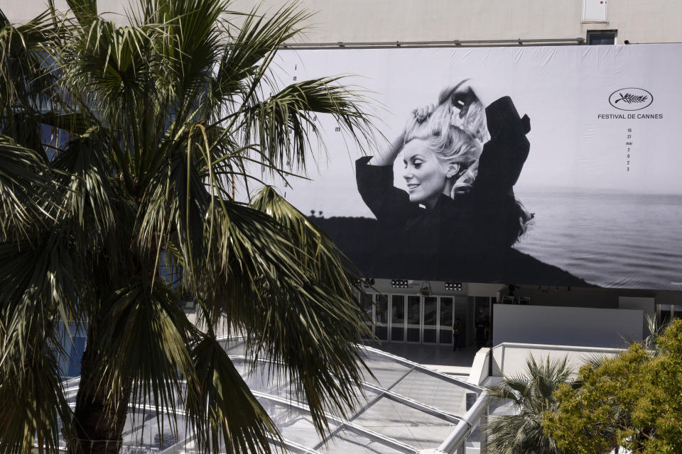 The official poster featuring actress Catherine Deneuve from the film 'La Chamade' is pictured on the facade of the Palais des Festivals ahead of the Cannes film festival, in Cannes, southern France, Monday, May 15, 2023. The 76th edition of the film festival runs from May 16 until May 27. (Photo by Joel C Ryan/Invision/AP)