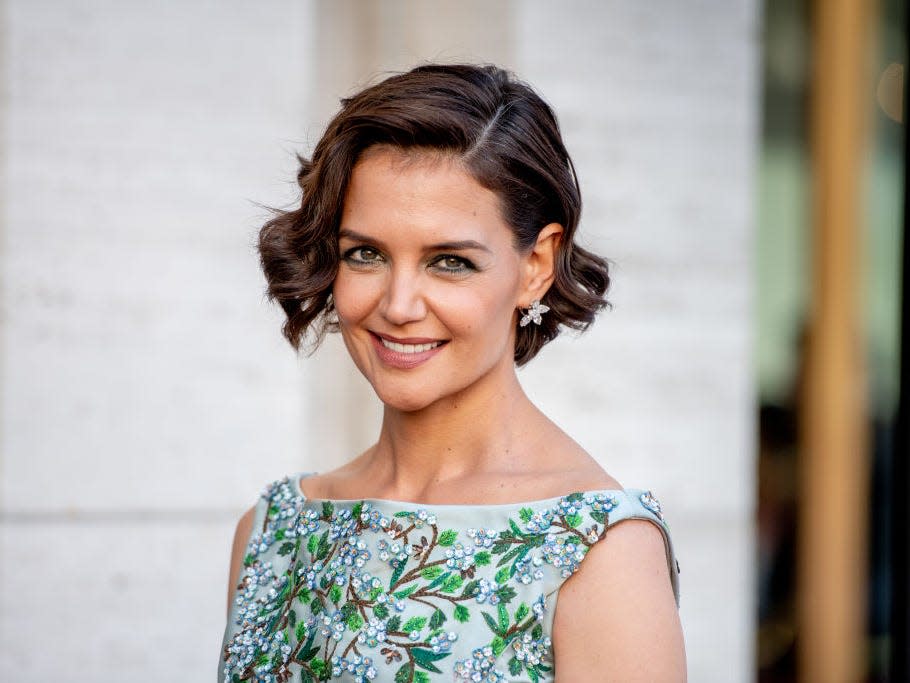 Katie Holmes smiles at an event.