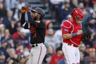 Baltimore Orioles' Cedric Mullins (31) celebrates his 3-run home run behind Boston Red Sox's Reese McGuire during the third inning of a baseball game, Saturday, April 1, 2023, in Boston. (AP Photo/Michael Dwyer)