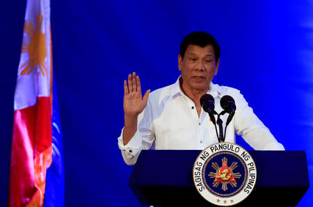 Philippine President Rodrigo Duterte gestures while delivering a speech during the 80th National Bureau of Investigation (NBI) founding anniversary at the NBI headquarters in metro Manila, Philippines November 14, 2016. REUTERS/Romeo Ranoco