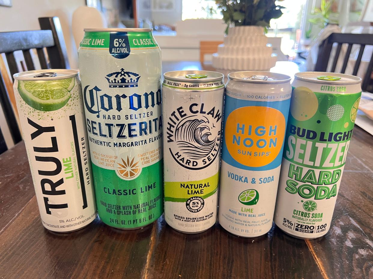 5 cans od lime hard seltzer lined up on a kitchen table