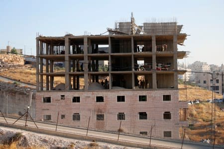 Israeli forces prepare to demolish a Palestinian building on the outskirts of Jerusalem