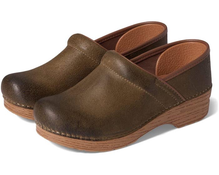 <div><p>"[The first time] I tried on Danskos they felt like heaven. I know that sounds really weird because they're wooden clogs, but the support that it had, and it had like a higher arch, so I didn't feel like my ankles or knees were buckling inward. So that's what I stuck with. I just go straight for the classic ones with the wooden sole. I have a couple of different pairs in different patterns and colors; one of them is cheetah print. I think it gets a little personality too, which I like." — ColesDansko Professional clogs come in 10 colors in women's sizes 4.5-13 and men sizes 4.5-10. This popular style has PU soles printed with a wood pattern.</p><p><i>You can buy the <a href="https://www.tkqlhce.com/click-8953967-11554337?sid=shoes-nurses-recommend-fjollaarifi-03-21-2023-7370271&url=https%3A%2F%2Fwww.zappos.com%2Fp%2Fdansko-professional-green-burnished-nubuck%2Fproduct%2F8315096%2Fcolor%2F997262" rel="nofollow noopener" target="_blank" data-ylk="slk:Dansko professional clogs;elm:context_link;itc:0;sec:content-canvas" class="link ">Dansko professional clogs</a> from Zappos for around $125-$140, or from <a href="https://www.amazon.com/Dansko-Womens-Professional-Metallic-Patent/dp/B001EJMZO0" rel="nofollow noopener" target="_blank" data-ylk="slk:Amazon;elm:context_link;itc:0;sec:content-canvas" class="link ">Amazon</a> for around $95-$135. </i></p></div><span> Zappos</span>