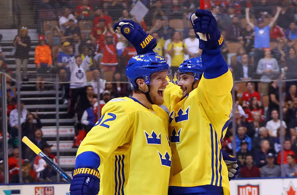 TORONTO, ON - SEPTEMBER 18: Gabriel Landeskog #92 (l) of Team Sweden celebrates his second period goal against Team Russia and is joined by Erik Karlsson #65 (r) during the World Cup of Hockey 2016 at the Air Canada Centre on September 18, 2016 in Toronto, Canada. (Photo by Bruce Bennett/Getty Images)