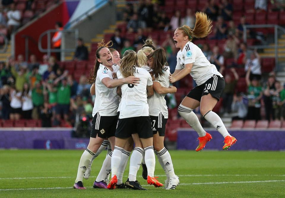 Northern Ireland’s Julie Nelson is mobbed by team-mates after scoring their side’s first goal at a major tournament (Nigel French/PA) (PA Wire)