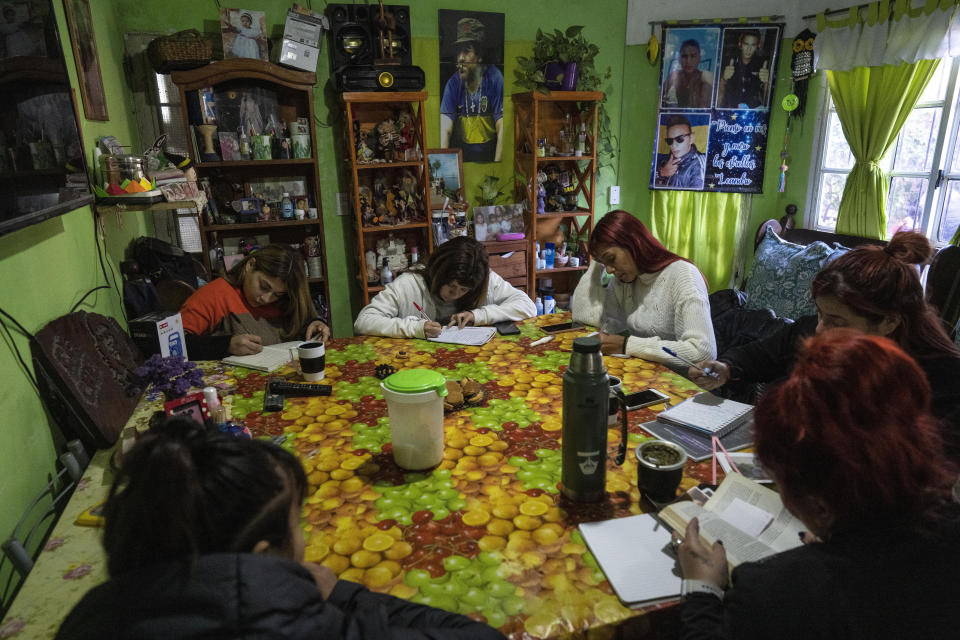 Members of the Frente Popular Dario Santillan social organization attend a gender workshop in the poverty-stricken Carmen de Alvear neighborhood, in the Tigre district, on the outskirts of Buenos Aires, Argentina, Monday, May 23, 2022. Social organizations and assistance programs keep a lid on simmering social unrest in Argentina. Without them, “everything would blow up,” said Jorge Cabral, a member of the Frente Popular Darío Santillan. (AP Photo/Rodrigo Abd)