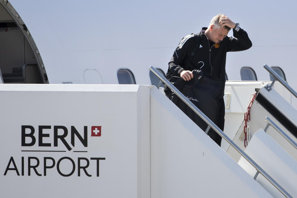 Manchester United's head coach Ole Gunnar Solskjaer disembarks from a plane as he arrives at the Bern Airport, Switzerland Monday, Sept. 13, 2021 one day ahead of the Champions League soccer match between Young Boys Bern and Manchester United. (Peter Klaunzer/Keystone via AP)