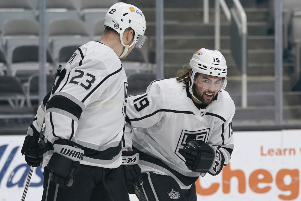 Los Angeles Kings right wing Alex Iafallo (19) celebrates with right wing Dustin Brown (23) after scoring against the San Jose Sharks during the second period of an NHL hockey game in San Jose, Calif., Wednesday, March 24, 2021. (AP Photo/Jeff Chiu)