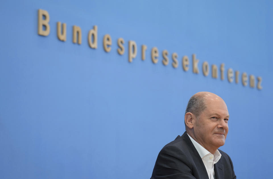 German Chancellor Olaf Scholz attends his first annual summer news conference in Berlin, Germany, Thursday, Aug. 11, 2022. Word in the background reads 'Federal Press Conference'. (AP Photo/Michael Sohn)