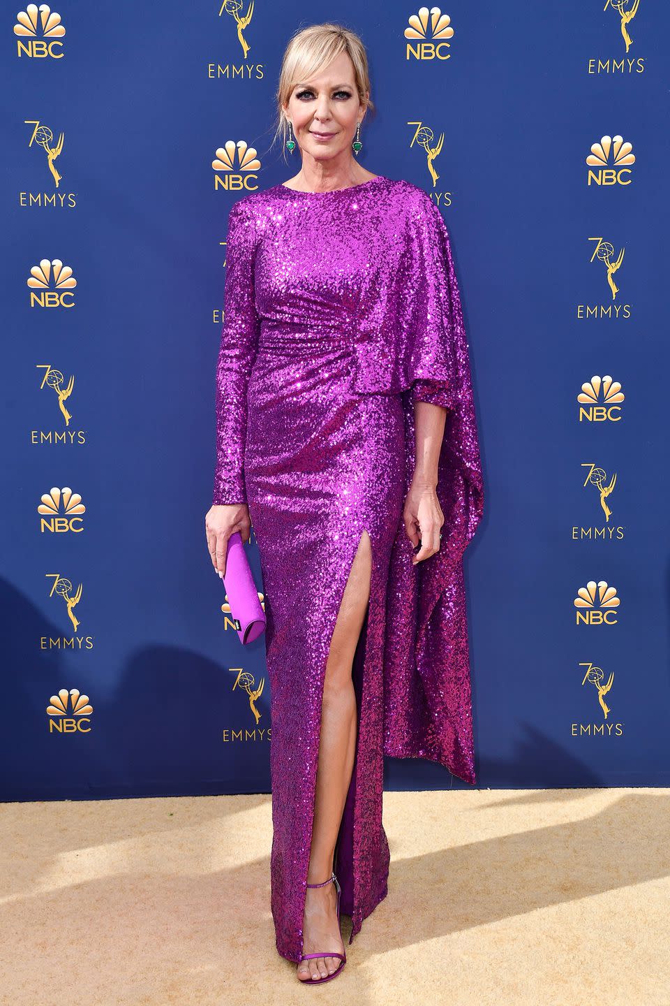 <p>Giving us all the Christmas party inspiration on the night as Allison Janney, who made a very convincing case for colourful sequins. The actress' sparkly purple number – which was designed by Prabal Gurung – featured a thigh-high slit and an exaggerated sleeve. She wore matching purple accessories, except for her green earrings, which perfectly offset the look.</p>