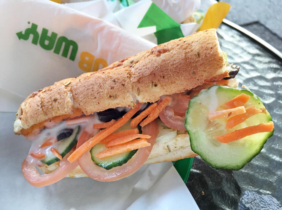 SUBWAY sandwich on a table. It's the largest single-brand restaurant chain in the world with 43,035 restaurants in 108 countries