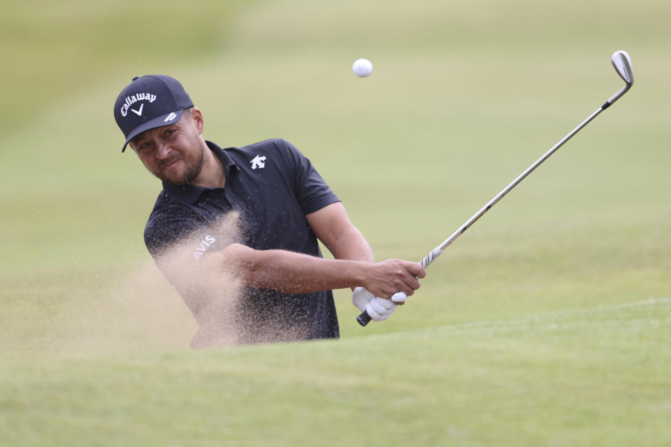 Xander Schauffele of the United States plays out of a bunker on the 16th hole during a practice round for the British Open Golf Championships at Royal Troon golf club in Troon, Scotland, Monday, July 15, 2024. (AP Photo/Peter Morrison)