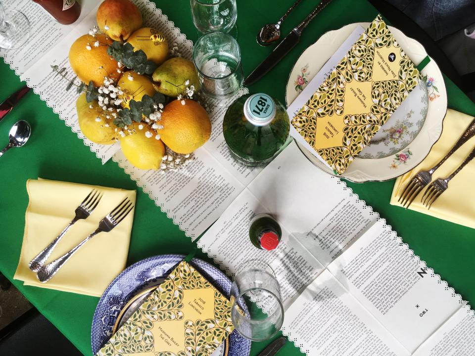 The tablescape, with pages from Hurston's books.