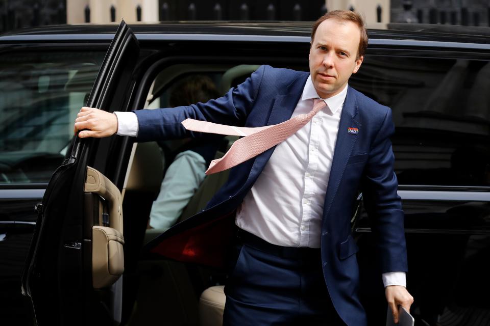 Britain's Health Secretary Matt Hancock arrives in Downing Street in central London on May 5, 2020 for the daily novel coronavirus COVID-19 briefing. - Britain was poised on Monday to roll out a new smartphone tracing app for coronavirus on an island off England's south coast, as the country looks to ease a six-week nationwide lockdown. The app, developed by the state-run National Health Service (NHS), will be trialled on the Isle of Wight ahead of its planned rollout across Britain later this month. (Photo by Tolga AKMEN / AFP) (Photo by TOLGA AKMEN/AFP via Getty Images)