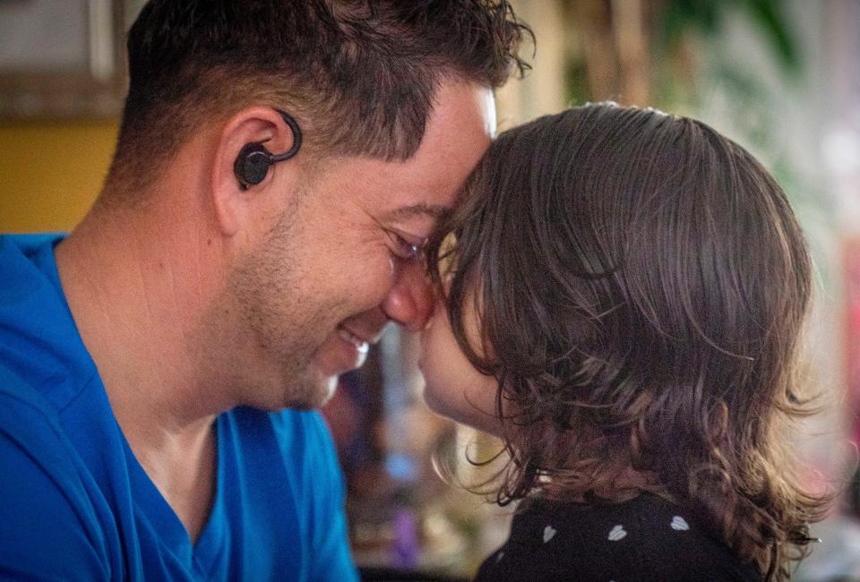 Javier Galeano nose to nose with his daughter Amy Galeano, 4, at their home in Lake Worth Beach. Amy struggles with infections that emerge when her body's immune system is compromised by chemotherapy.