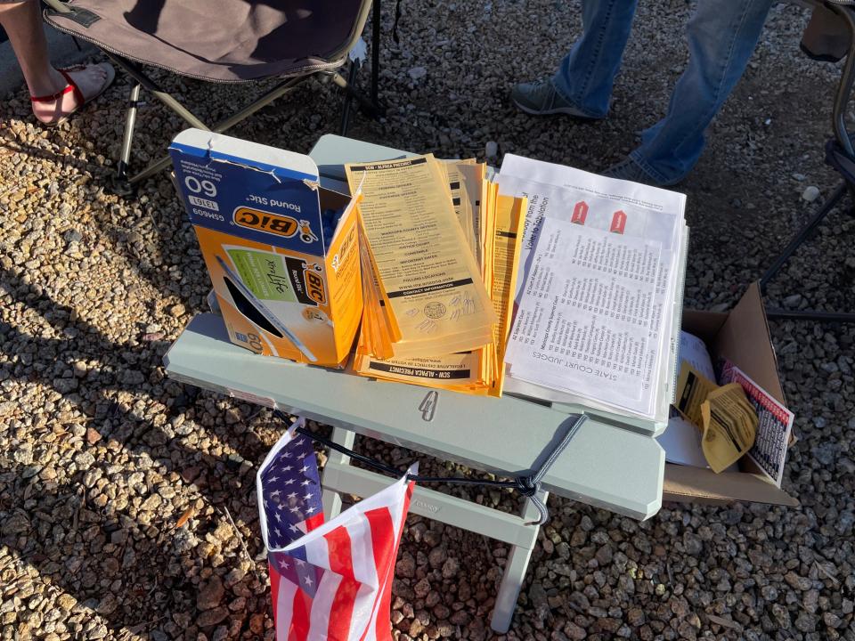 GOP volunteers handed out ballpoint pens to voters at a polling station in Sun City West on Nov. 8, 2022.