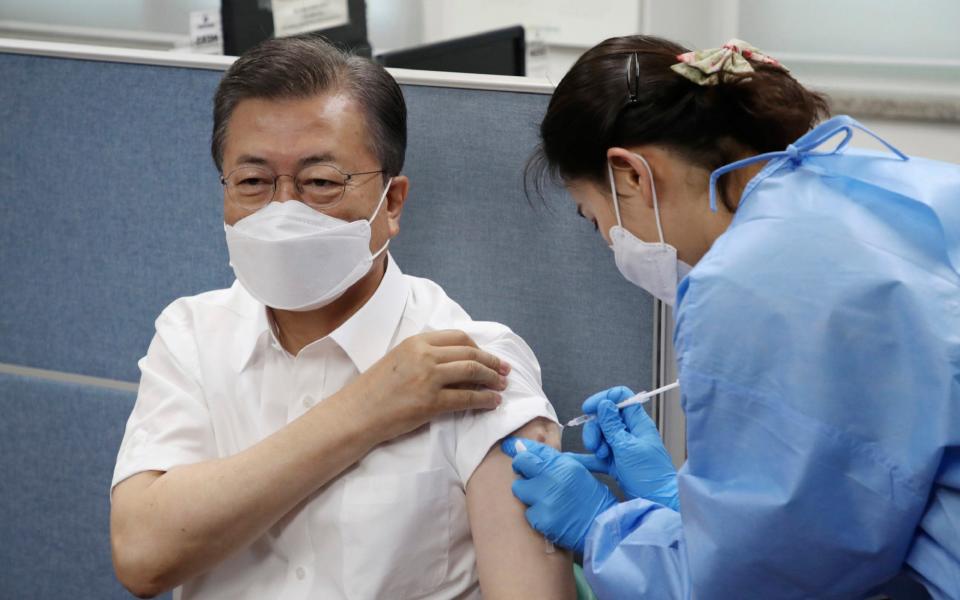 South Korean President Moon Jae-in receives a dose of the AstraZeneca COVID-19 vaccine at a health care centre in Seoul  - AP