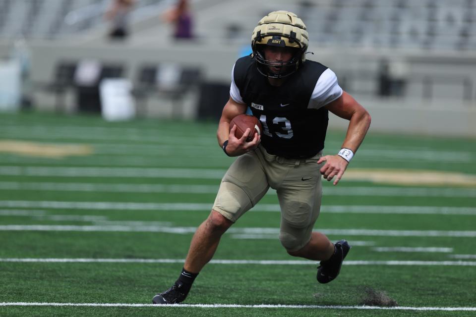 Army junior quarterback Bryson Daily rolls out on a scrimmage play on Saturday at Michie Stadium.