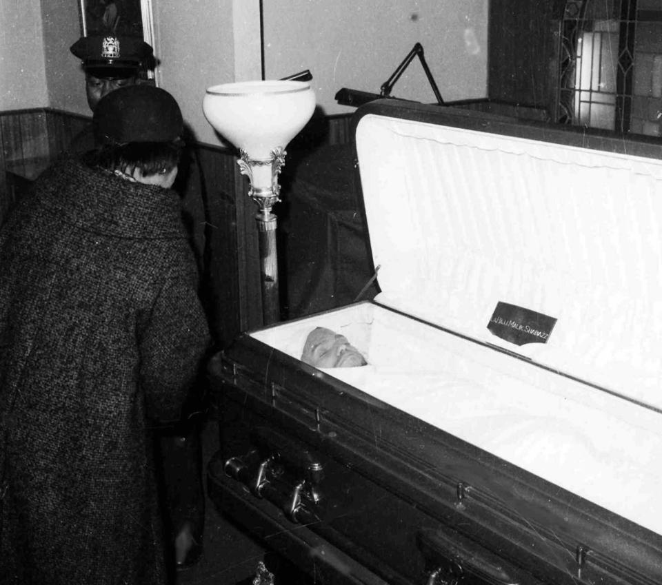 Malcolm X's widow, Betty Shabazz, regarded the body of her late husband before the casket was closed after funeral services at the Faith Temple of God in Christ on Feb. 27, 1965, in Harlem.