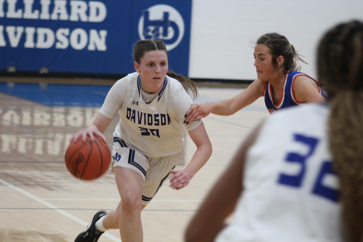Davidson senior guard Kierstyn Liming looks to drive past Olentangy Orange's Ellie Beck during their game Jan. 21. Liming scored a game-high 21 points in leading the host Wildcats to a 43-32 win.