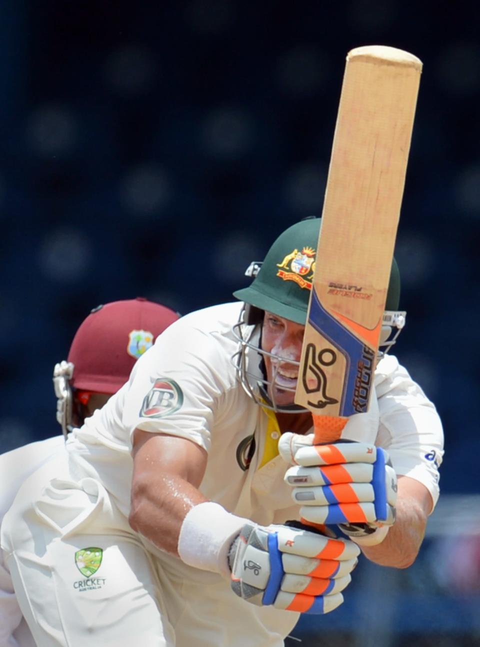 Australian batsman Michael Hussey plays a shot during the final day of the second-of-three Test matches between Australia and West Indies April 19, 2012 at Queen's Park Oval in Port of Spain, Trinidad.