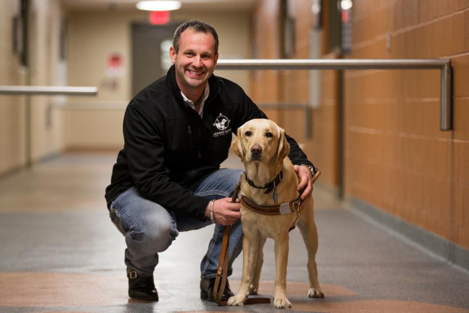 Dave Bann, Leader Dogs fort the Blind corporate engagement manager and his dog Coco at the Leader Dogs for the Blind campus in Rochester Hills, Tuesday, Jan. 1, 2019.