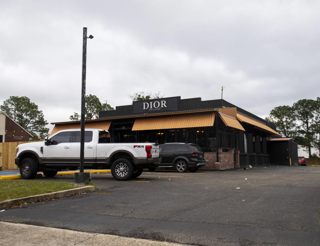 FILE - Dior Bar & Lounge on Bennington Avenue was the scene of an overnight shooting that left multiple people injured, Jan. 22, 2023, in Baton Rouge, La. On Friday, Feb. 10, police in Louisiana's capital city of Baton Rouge arrested two people for a mass shooting that left 12 others wounded at a nightclub in January. (Michael Johnson/The Advocate via AP)
