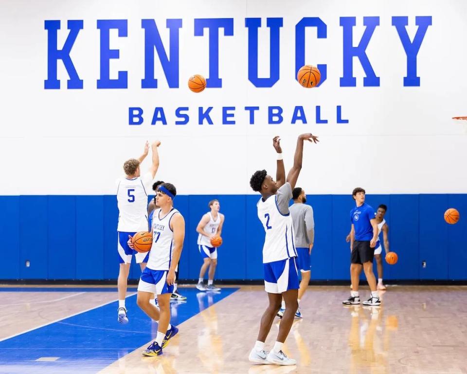 Kentucky basketball players shoot around in the Joe Craft Center as part of the team’s summer practice sessions.