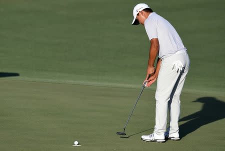 May 14, 2017; Ponte Vedra Beach, FL, USA; Si Woo Kim putts out winning The Players Championship golf tournament at TPC Sawgrass - Stadium Course. Mandatory Credit: John David Mercer-USA TODAY Sports