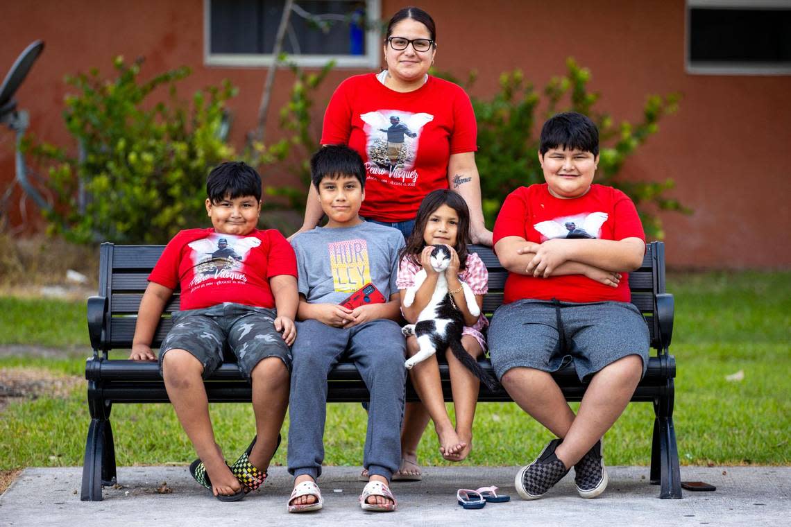 Mom Laura Canchola, 28, stands above her children, from left to right, Mario Vasquez, 8, Pedro Vasquez, 11, Aubrey Vasquez, 5, and Jayden Vasquez, 9. This is the children’s first holiday season without their dad.