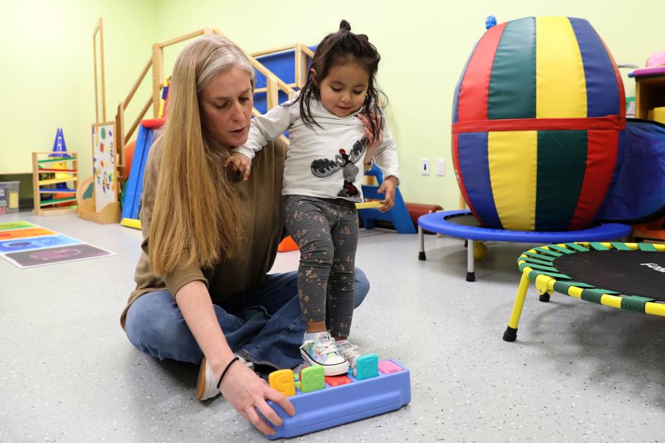 Physical therapist Ilyse Lesser works with two-year-old Hazel on strengthening her legs, balance and core at the Jawonio early intervention program in New City March 2, 2023.