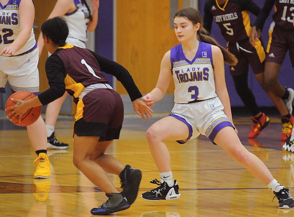 Sebring McKinley's Allie Hoschar defends against Cleveland John Adams Laveshonay Morris in a non-conference game at McKinley High School Monday, November 28, 2022.