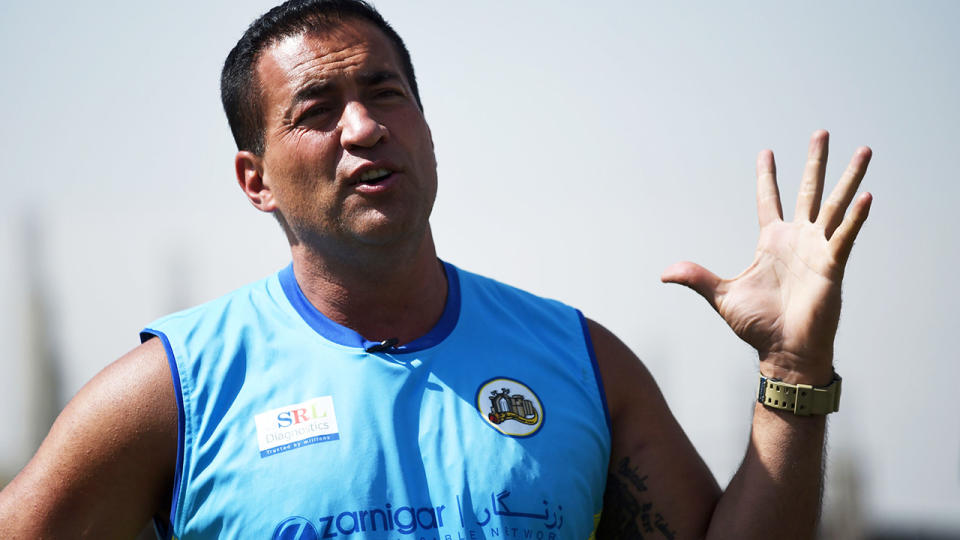 Adam Hollioake, pictured here speaking to media in Afghanistan.