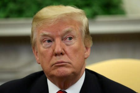 FILE PHOTO: U.S. President Donald Trump look on as he welcomes South Korea's President Moon Jae-In in the Oval Office of the White House in Washington, U.S., May 22, 2018. REUTERS/Kevin Lamarque /File Photo