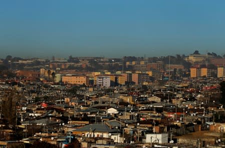 FILE PHOTO: A general view shows Alexandra Township, an informal settlement for thousands of South Africans who lack the means to get a proper home, located near the upper-class suburb of Sandton in Johannesburg