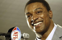 FILE - In this April 23, 2005 file photo Cedric Benson, a running back from Texas, talks to the media after he was chosen the first pick of the Chicago Bears, the fourth overall, at the 2005 NFL draft in New York. Benson, one of the most prolific rushers in NCAA and University of Texas history, has died in a motorcycle accident in Texas, Saturday, Aug. 17, 2019. He was 36. (AP Photo/Adam Rountree, file)