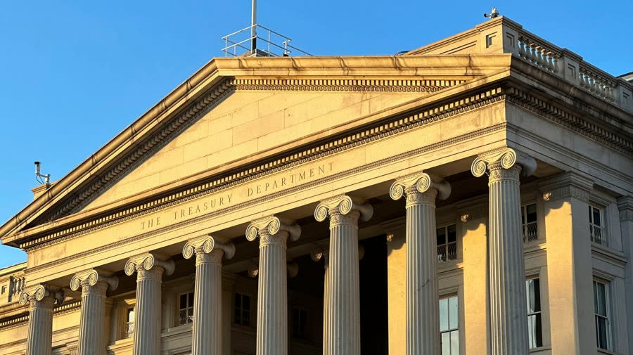 <sub>The Treasury Department is seen near sunset in Washington, Wednesday, Jan. 18, 2023. (AP Photo/Jon Elswick, File)</sub>