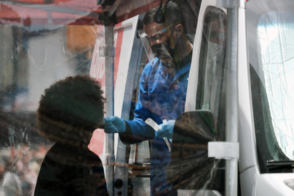 A person is tested at a COVID-19 testing van in Times Square in New York City in 2022