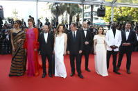 Jury president Vincent Lindon, center, poses with jury members Deepika Padukone, from left, Rebecca Hall, Asghar Farhadi, Jasmine Trinca, Joachim Trier, Noomi Rapace, Ladj Ly, and Jeff Nichols upon arrival at the opening ceremony and the premiere of the film 'Final Cut' at the 75th international film festival, Cannes, southern France, Tuesday, May 17, 2021. (Photo by Joel C Ryan/Invision/AP)