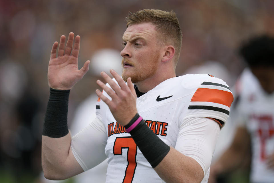 Oklahoma State quarterback Alan Bowman warms up before an NCAA college football game against Iowa State, Saturday, Sept. 23, 2023, in Ames, Iowa. (AP Photo/Charlie Neibergall)