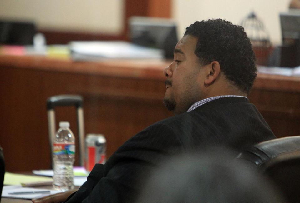 Efram Holmes, bodyguard of of singer Patti LaBelle, sits in the courtroom at the Harris County Criminal Courthouse on Thursday, Nov. 7, 2013, in Houston. LaBelle told a Houston court Thursday that Richard King scared her in 2011 when he staggered toward her limousine at George Bush Intercontinental Airport. LaBelle's bodyguard, Efrem Holmes, is charged with misdemeanor assault in the clash caught on security video that landed King in a hospital with a head wound. Records show King's blood alcohol level was more than three times the legal limit for driving. King testified Thursday that he could not remember details of the incident. King has also filed a civil lawsuit against the singer and Holmes. LaBelle has countersued.(AP Photo/Houston Chronicle, Mayra Beltran)