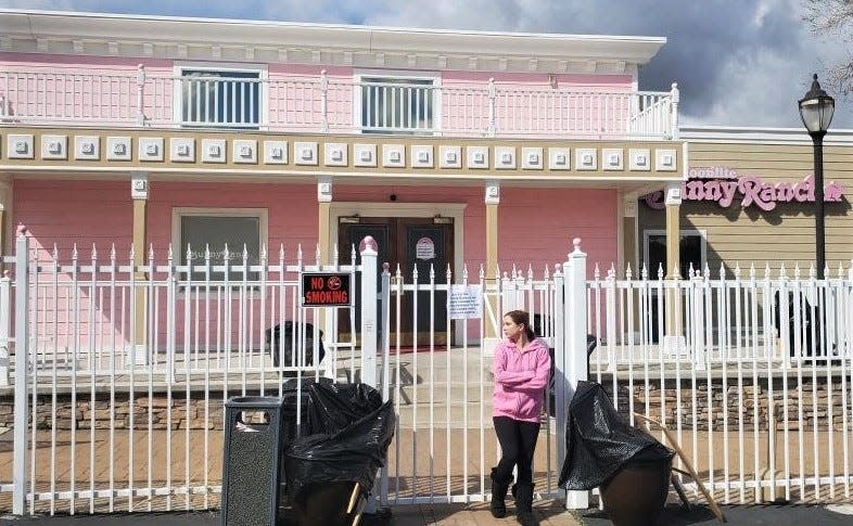 Sex worker Alice Little stands outside the closed Bunny Ranch brothel in Carson City, Nev.