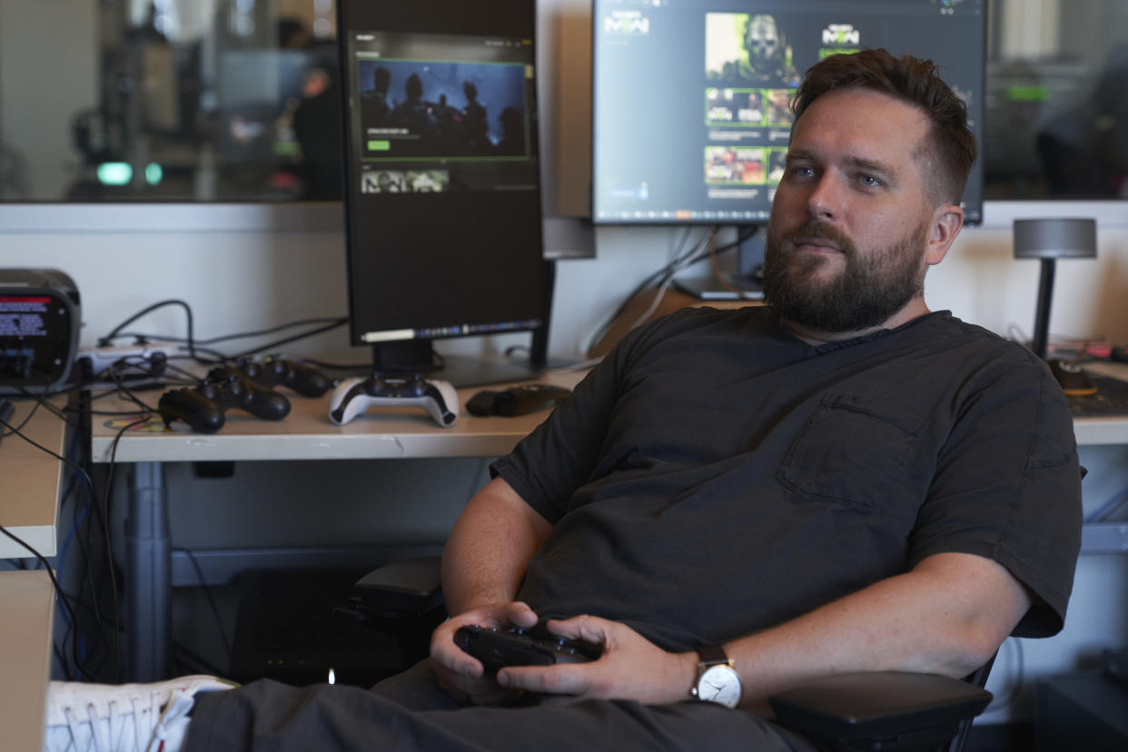 Jack O'Hara, game director for the video game series Call of Duty, works in his office on Friday, Oct. 21, 2022, at Activision Blizzard, Infinity Ward Division, in Woodland Hills, Calif. Call of Duty has been one of the best-selling video games for the past decade-plus, and is at the heart of the developing antitrust fight over whether Microsoft will be able to acquire Activision Blizzard. (AP Photo/Allison Dinner)