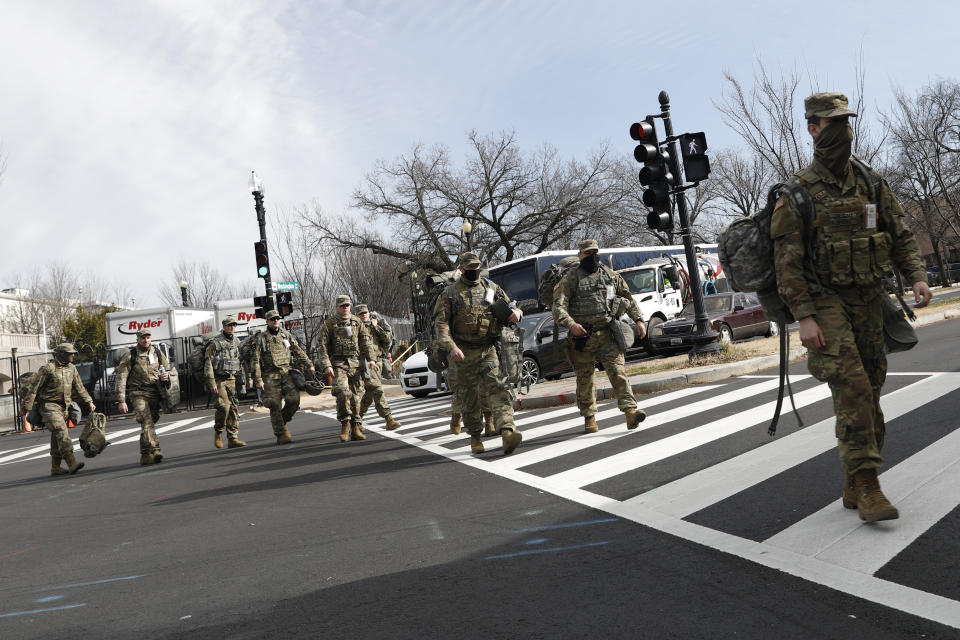 National Guard troops continue to be deployed around the Capitol one day after the inauguration of President Joe Biden, Thursday, Jan. 21, 2021, in Washington. (AP Photo/Rebecca Blackwell)