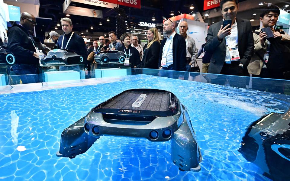 People view the Scuba S1 pool cleaner from Aiper on display at the Consumer Electronics Show (CES) on January 9, 2024 in Las Vegas, Nevada.